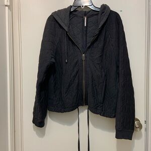 Free People Women’s (Medium) Black Quilted Jacket with Hood and zipper back.
